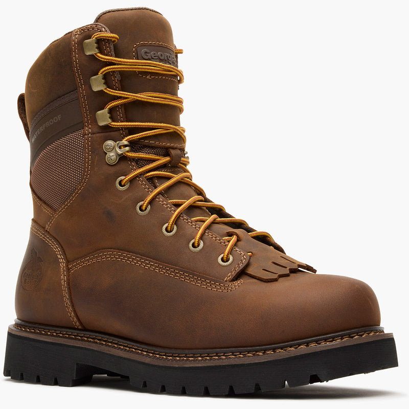 Brown hiking boot with orange laces on a white background