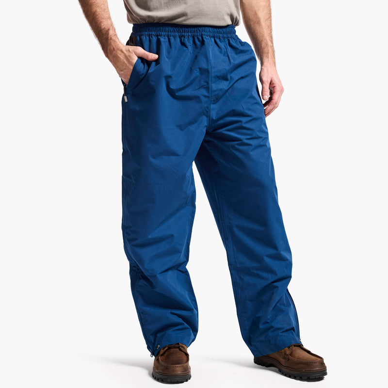 Blue pants worn by a person on a white background