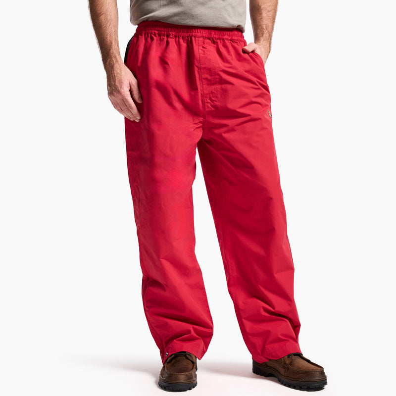 Red pants worn by a person on a white background