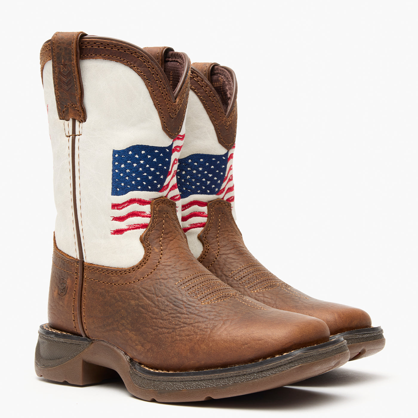 Brown and white kids western boot with American flag design on a grey background