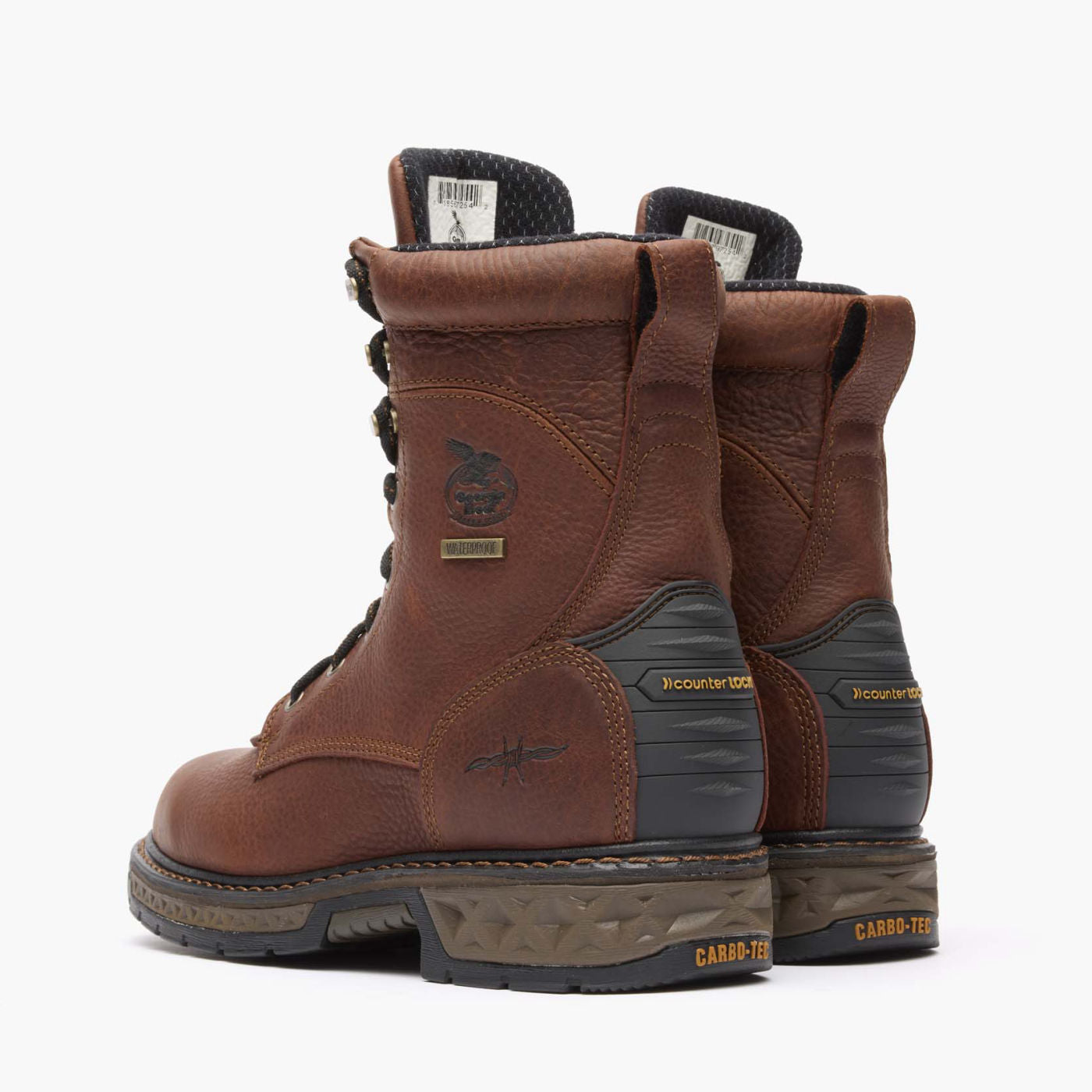 Pair of brown work boots with visible branding on a white background