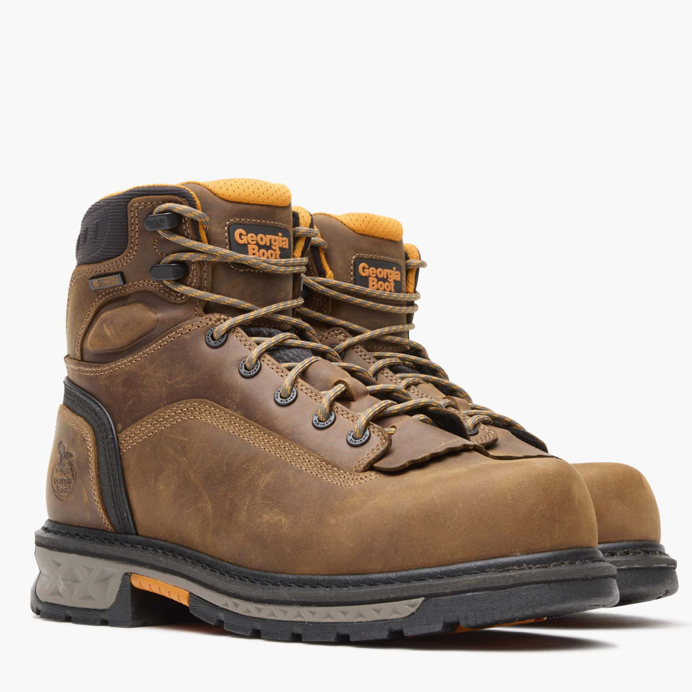 Brown hiking boot with visible brand logo on a white background