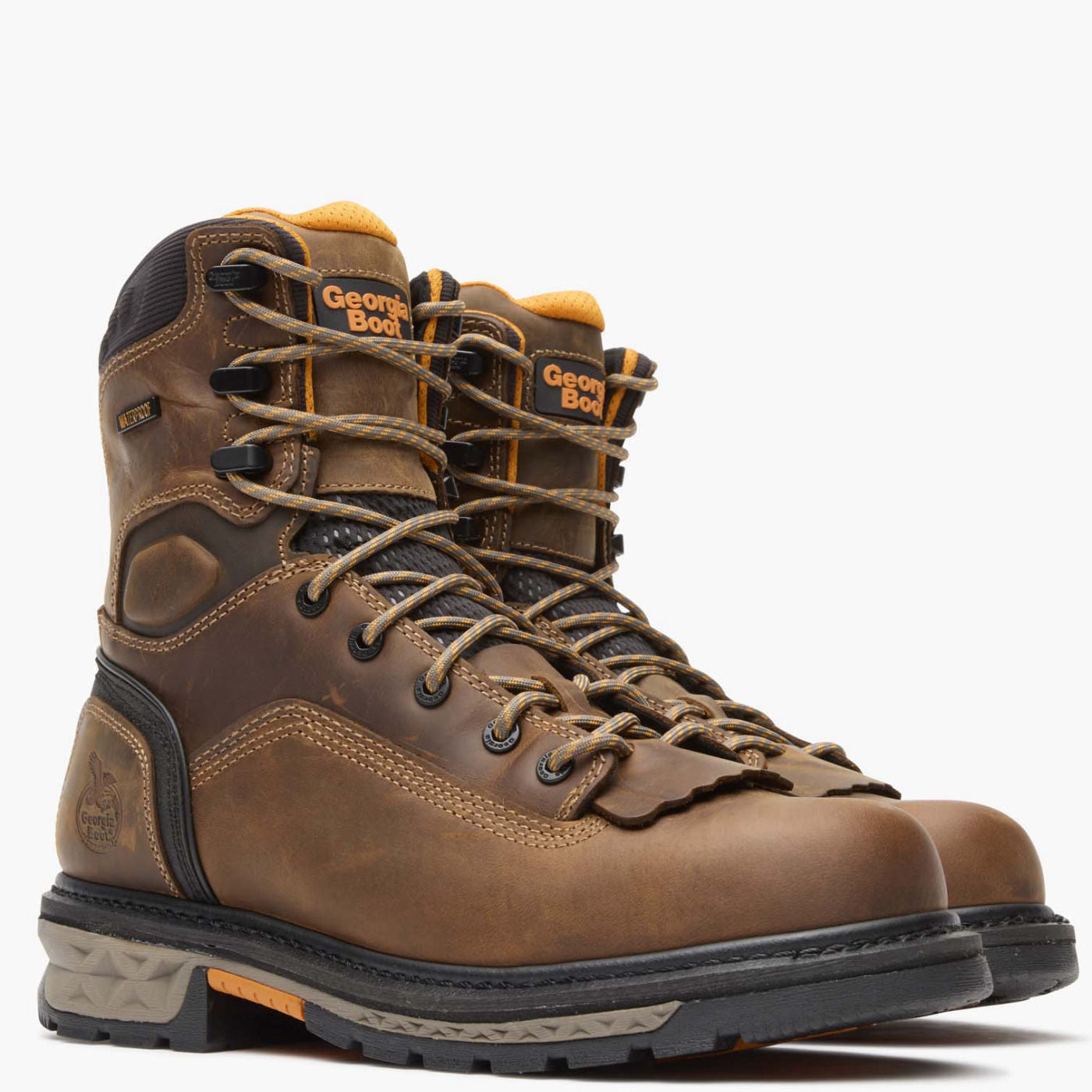 Pair of brown work boots with visible brand logo on a white background