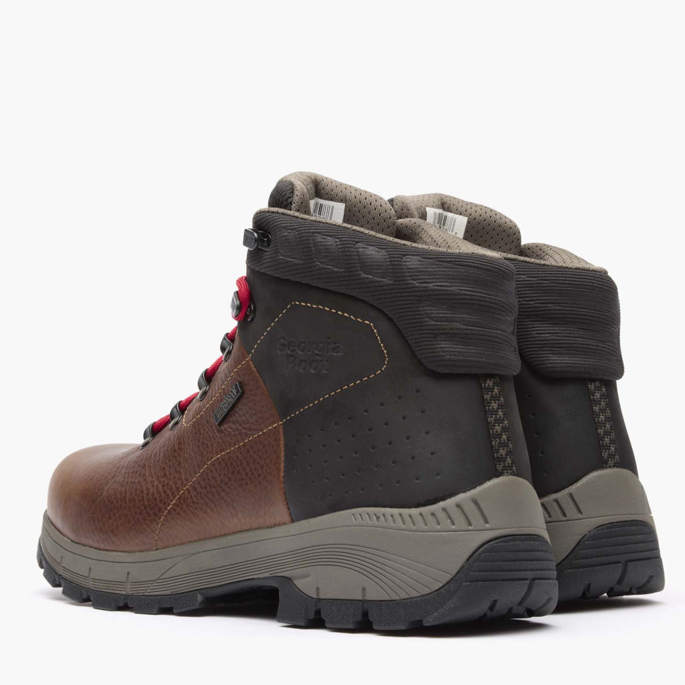 Pair of brown and black hiking boots with visible brand logo on a white background