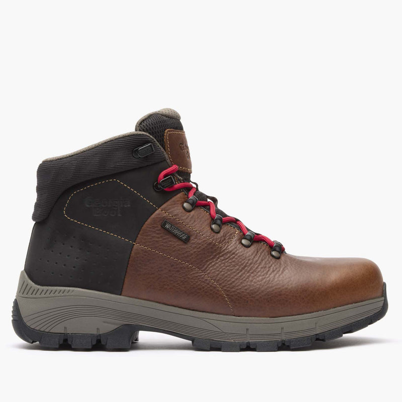 Brown leather boot with black and red accents on a white background