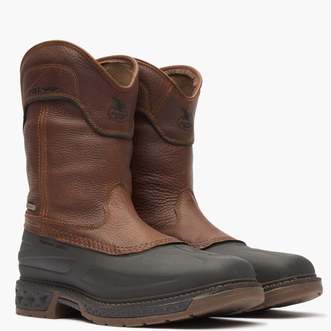 Pair of brown and black boots on a white background