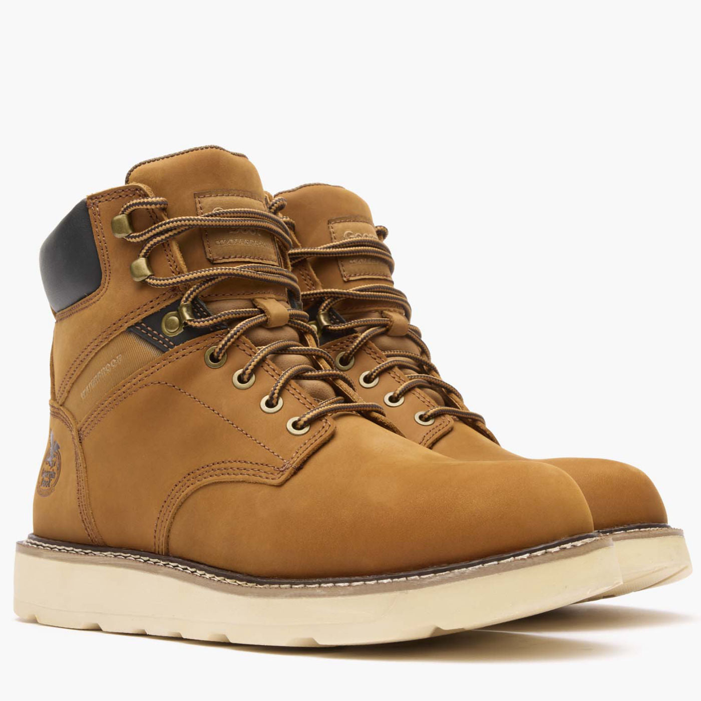 Brown leather boots with white soles on a white background