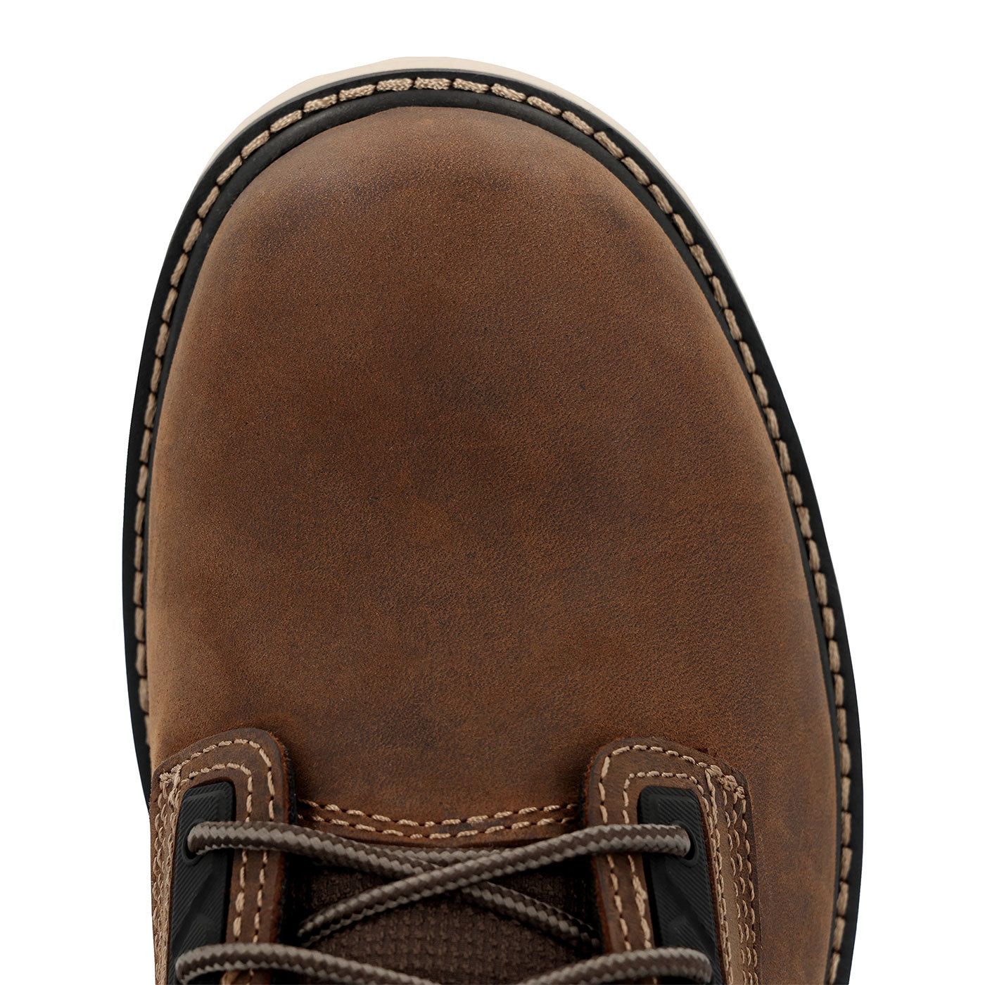 Close-up of a brown leather boot with visible stitching on a white background