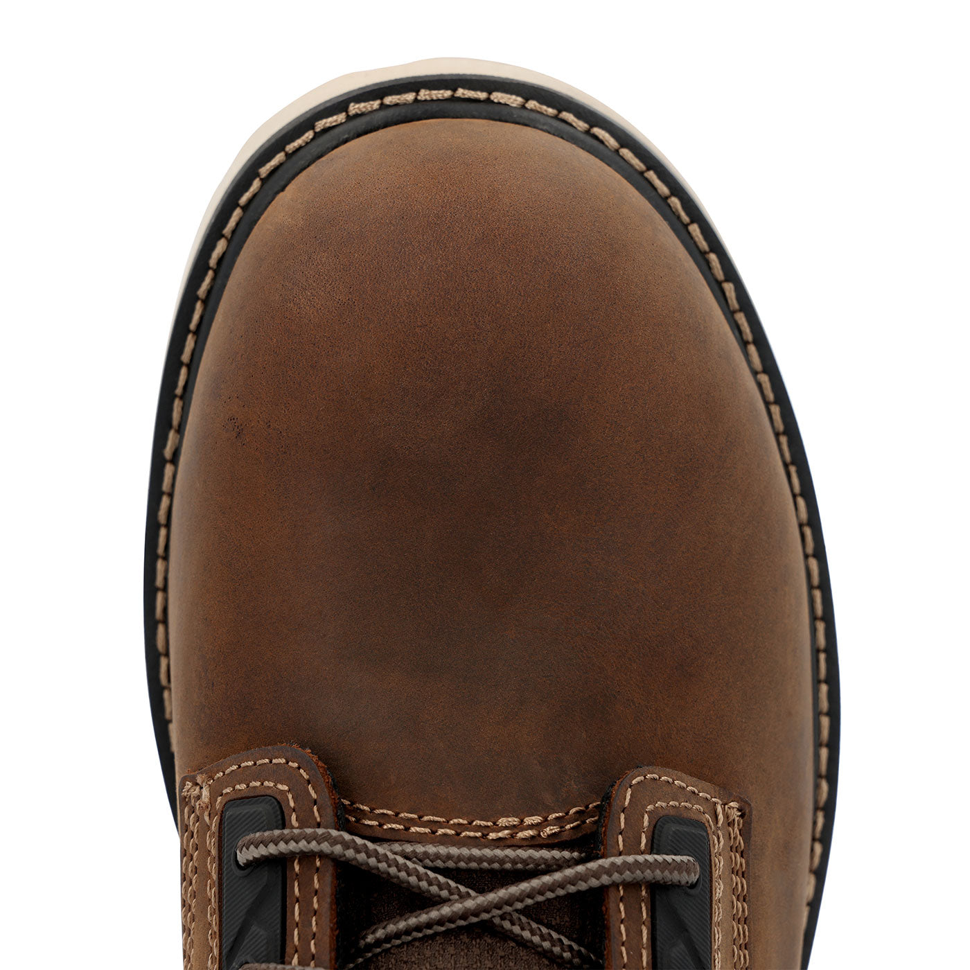 Close-up of a brown leather boot with visible stitching on a white background