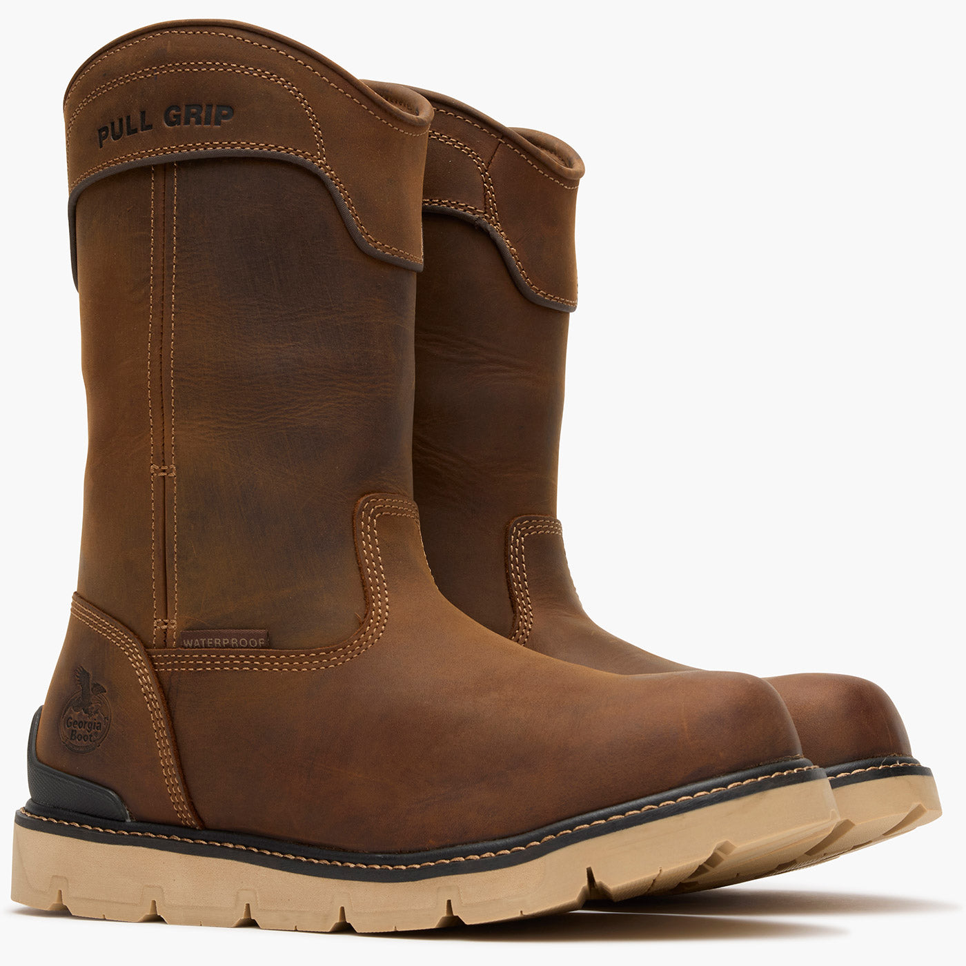 Pair of brown leather boots with 'Pull Grip' feature on a white background