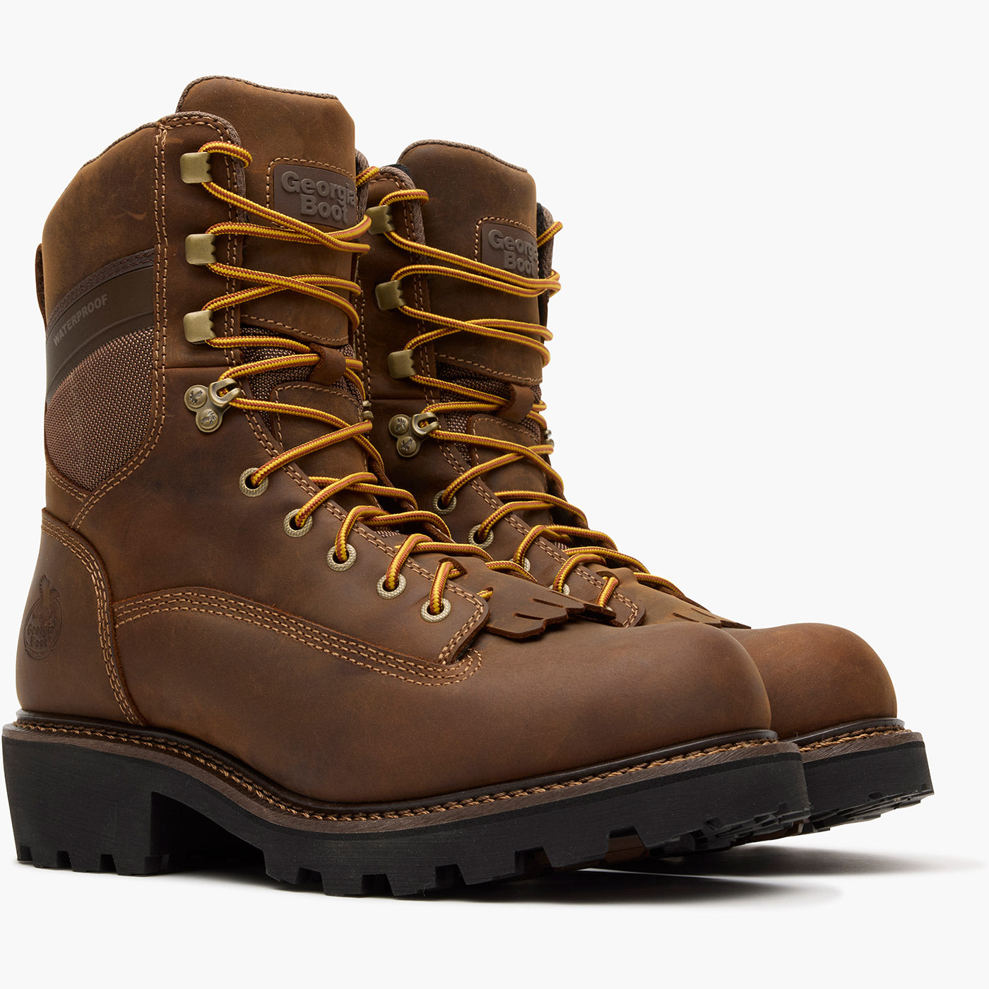 Pair of brown leather boots with yellow laces on a white background