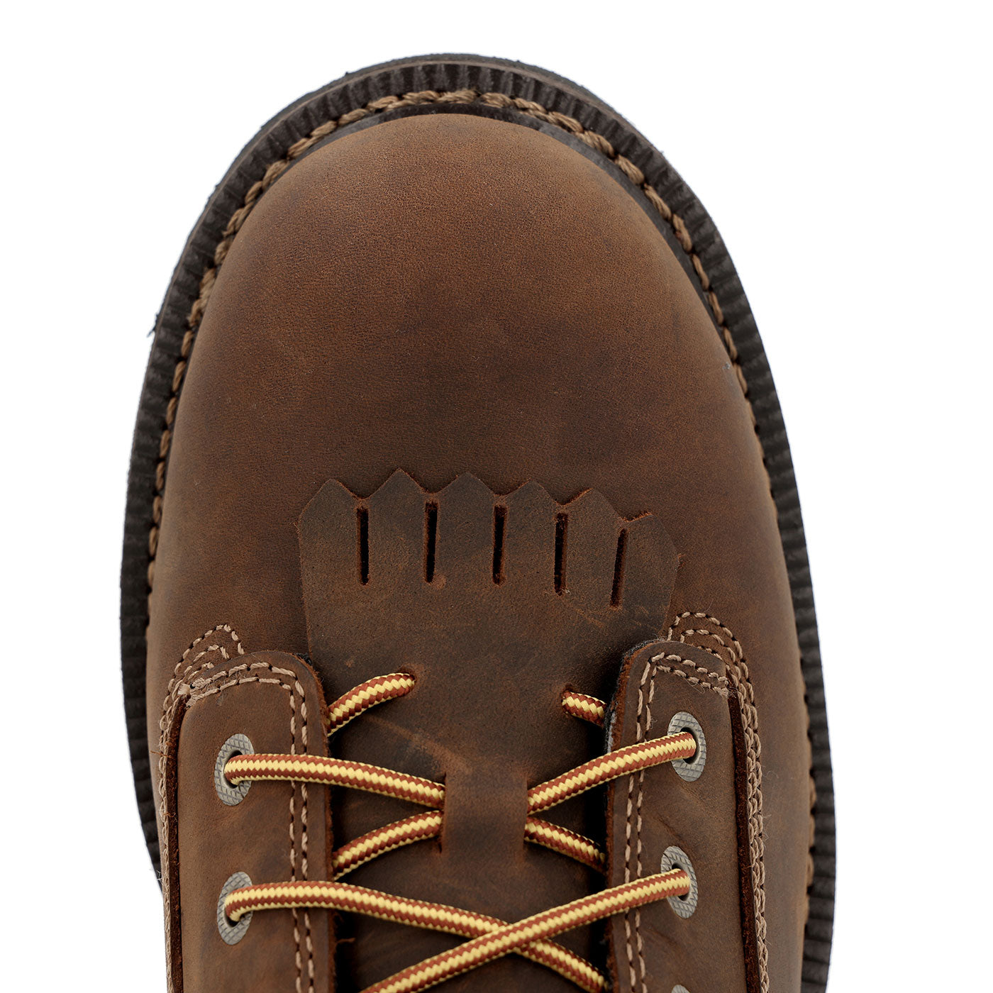 Close-up of a brown leather boot with gold laces on a white background
