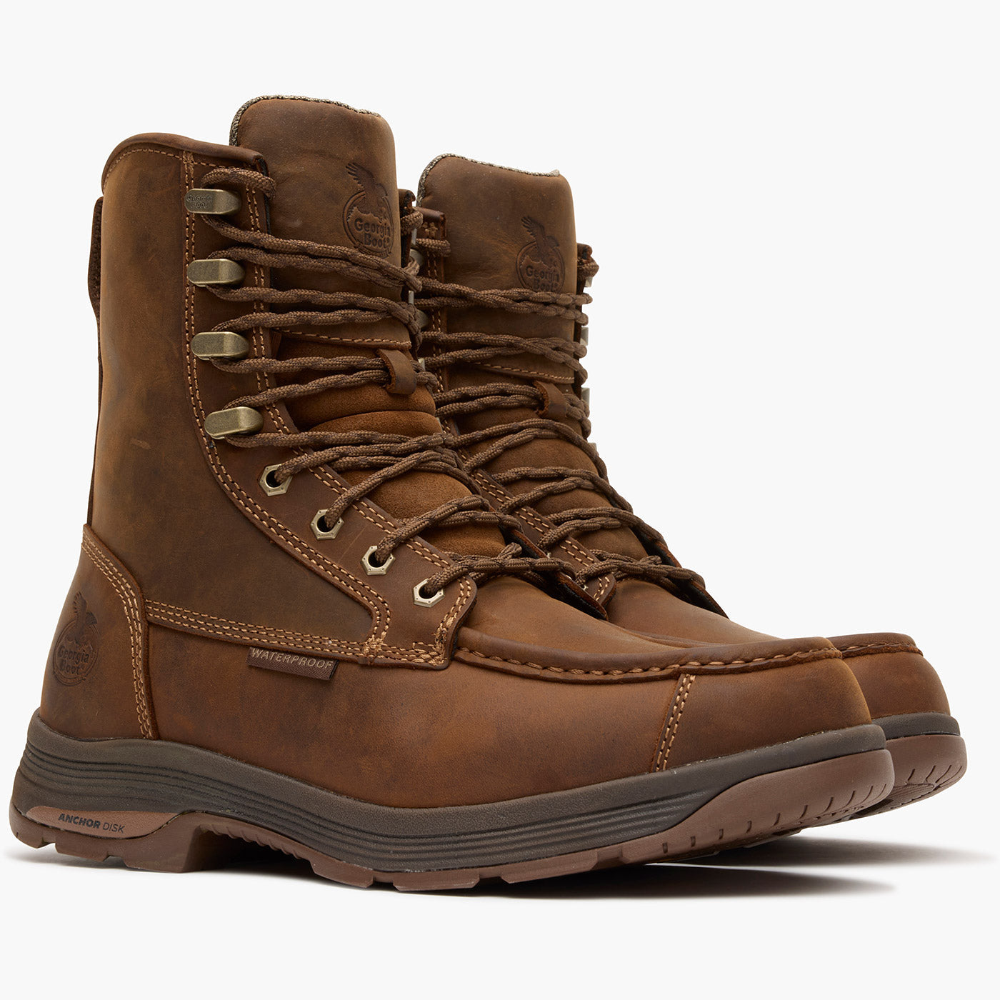 Pair of brown hiking boots on a white background