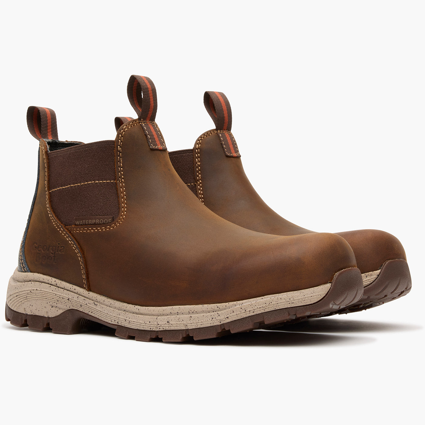 Pair of brown leather boots with a white background