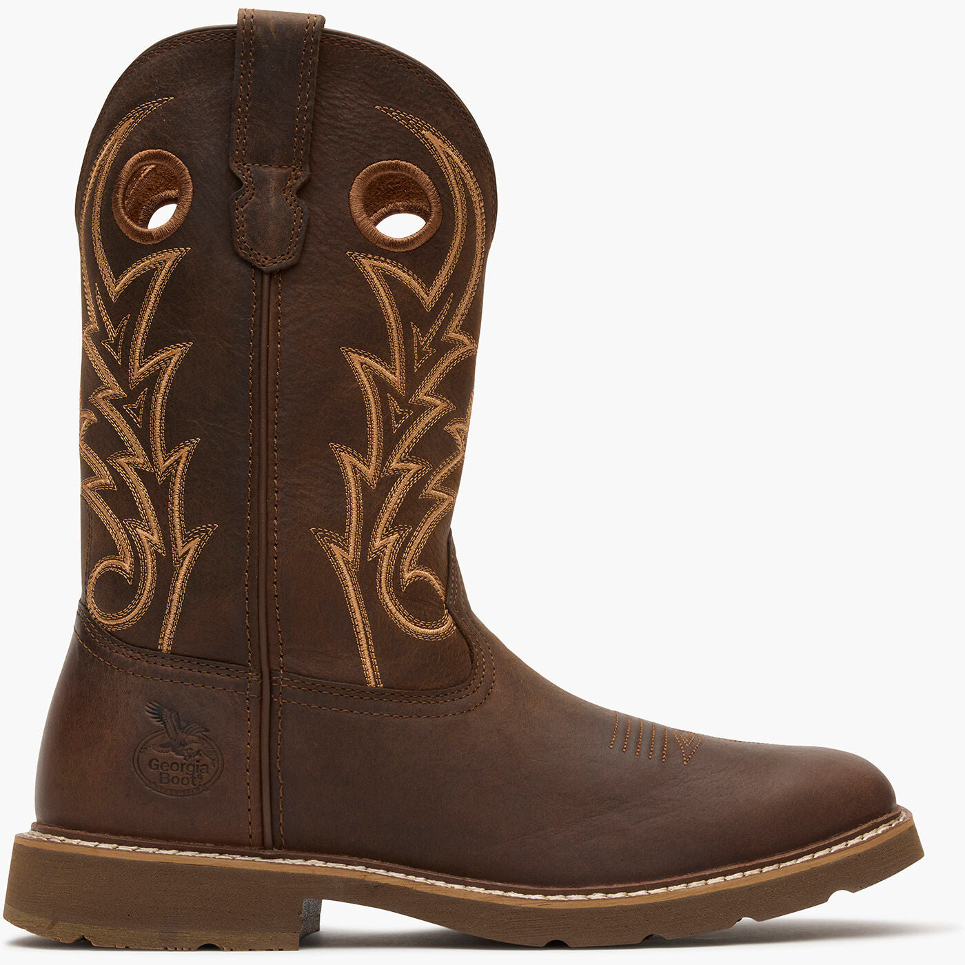 Brown cowboy boot with intricate stitching on a white background