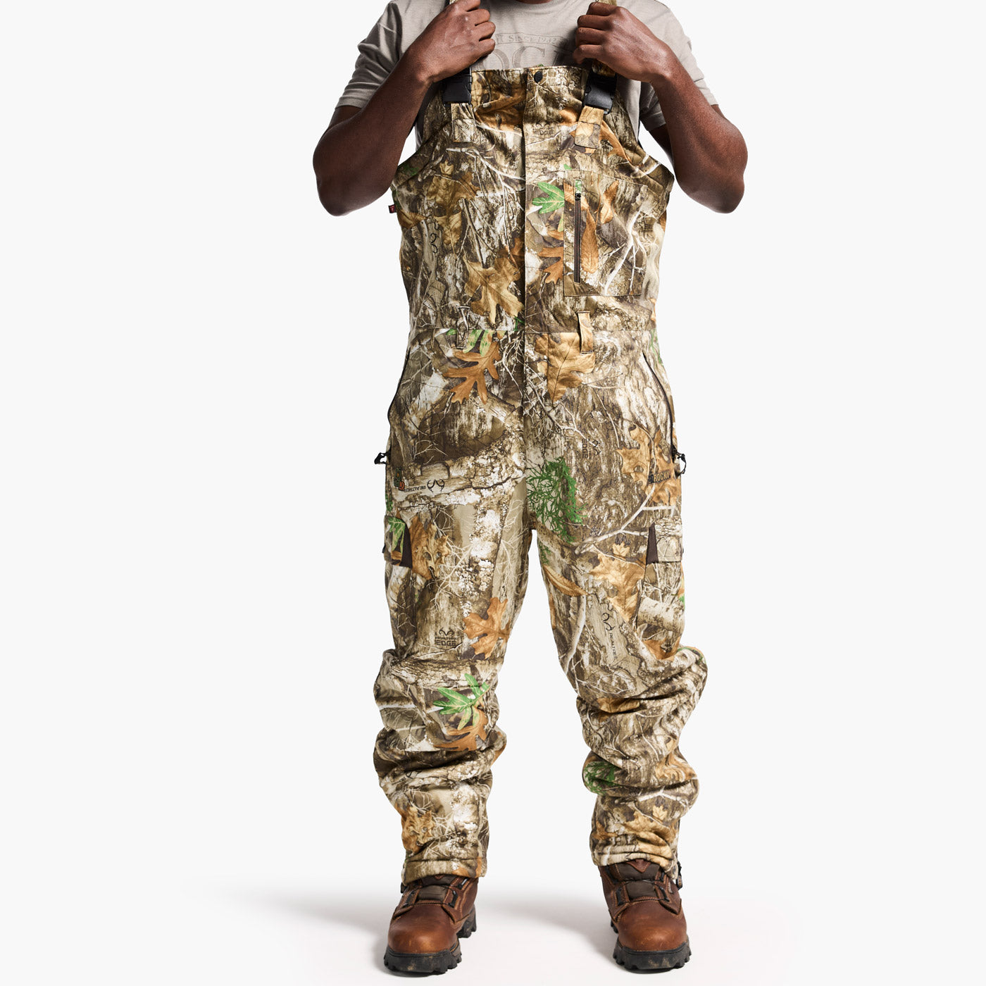 Camouflage hunting pants worn by a person on a white background