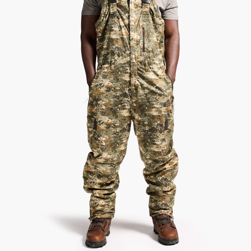 Camouflage overalls worn by a person on a white background