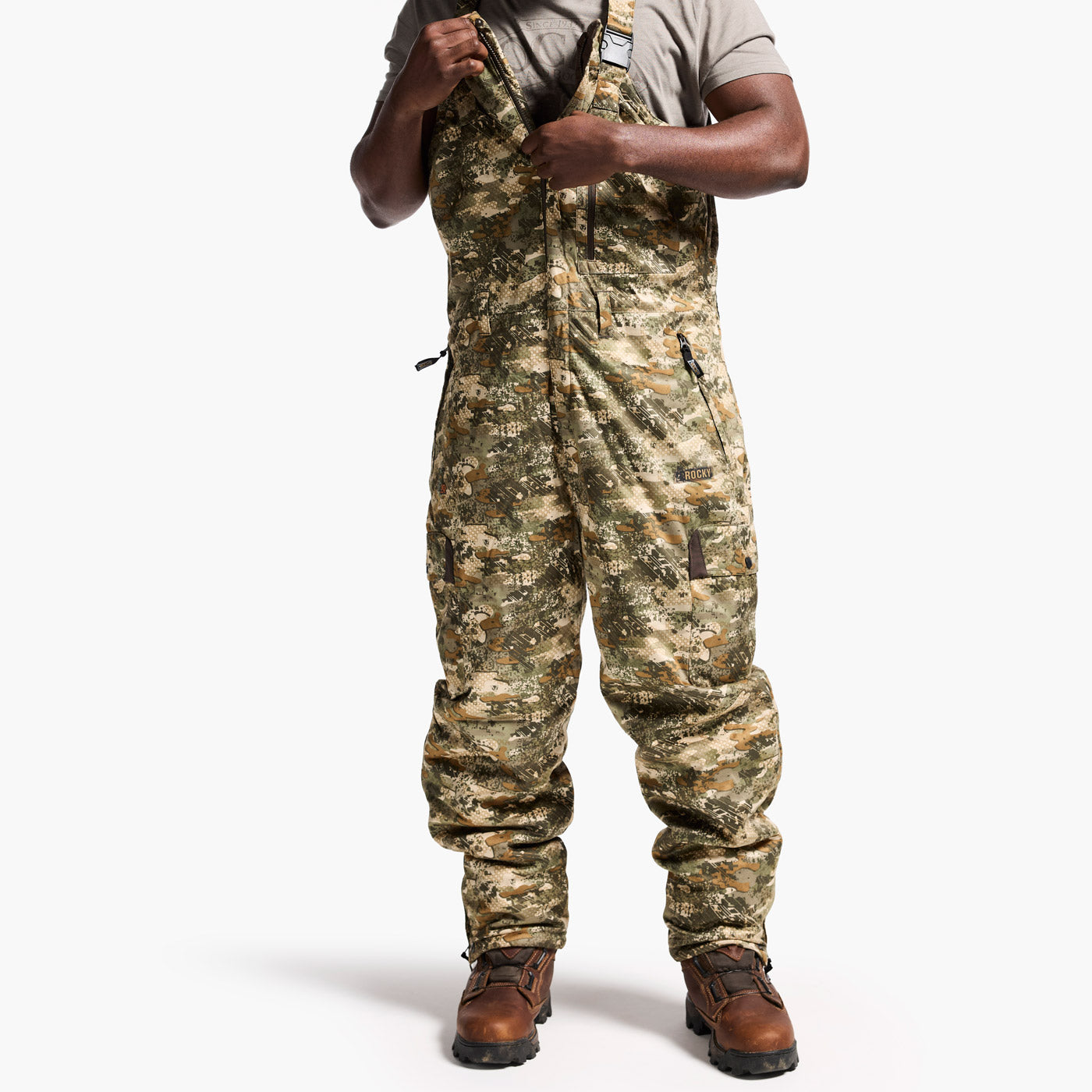 Person wearing camouflage overalls on a white background