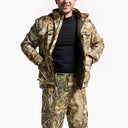 Man wearing a camouflage jacket and pants on a white background
