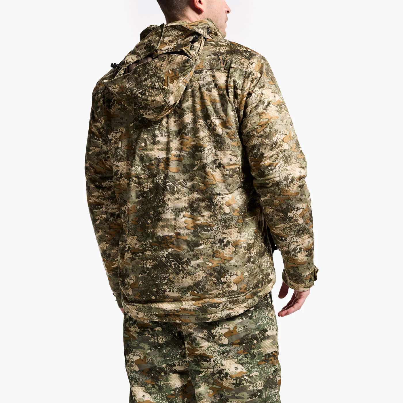 Person wearing a camouflage jacket on a white background