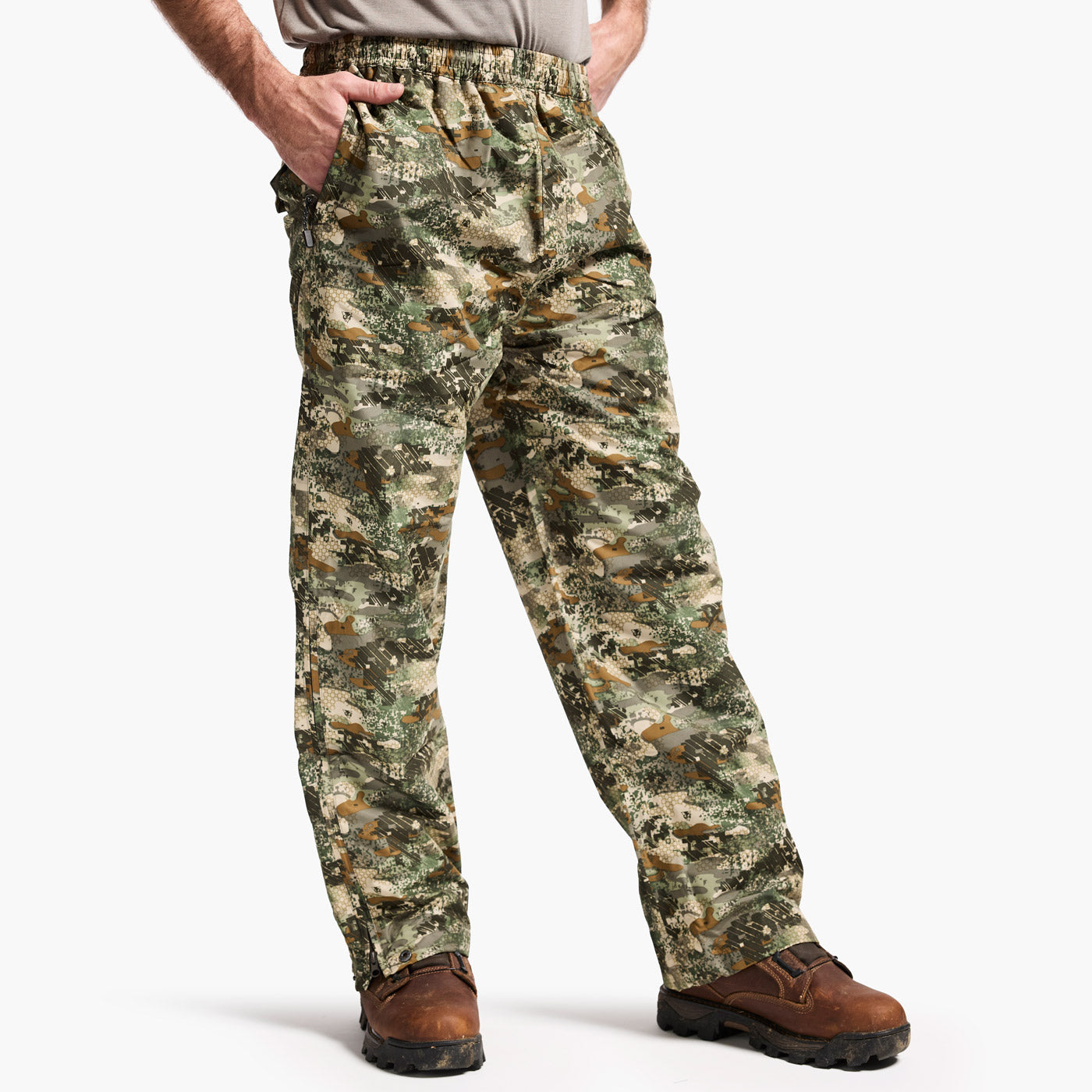 Camouflage pants worn by a person on a white background