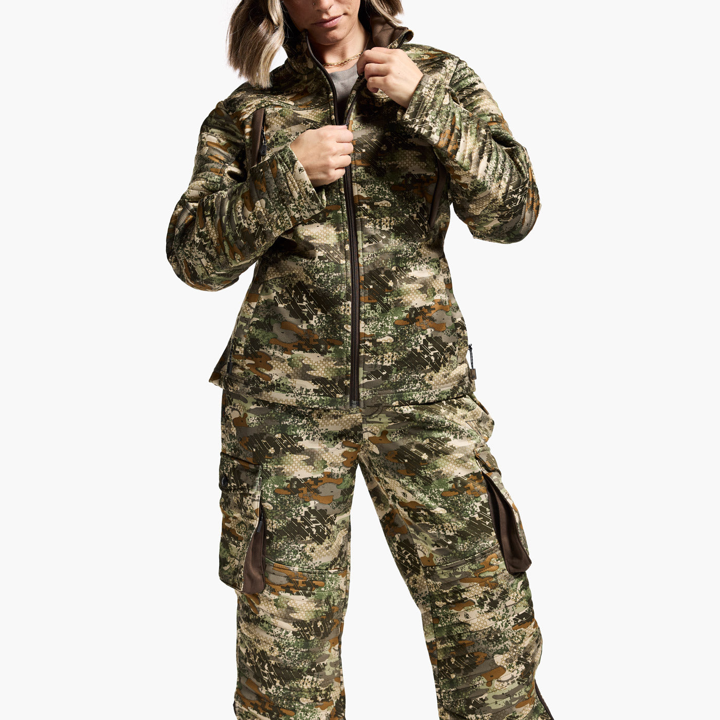 Person wearing a camouflage jumpsuit on a white background