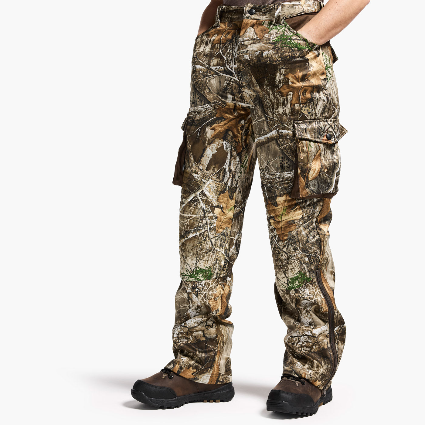 Camouflage pants worn by a person on a white background