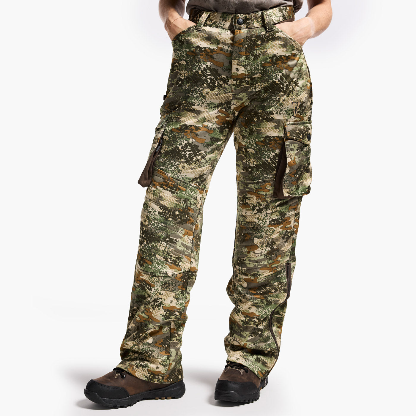 Camouflage pants worn by a person on a white background