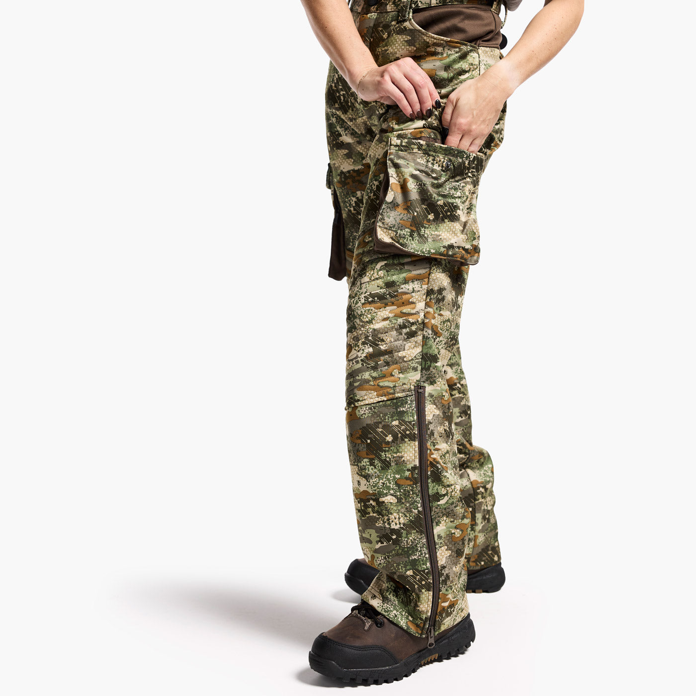 Camouflage hunting pants worn by a person on a white background