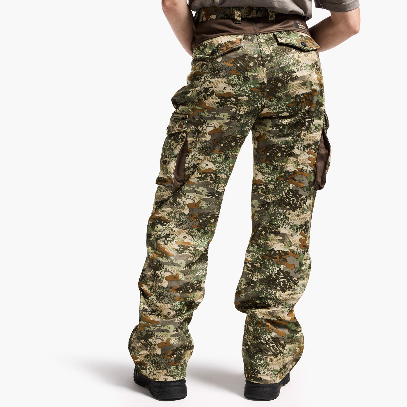 Camouflage pants worn by a person on a white background