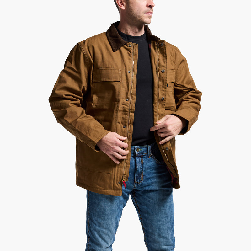 Man wearing a brown jacket and blue jeans on a white background