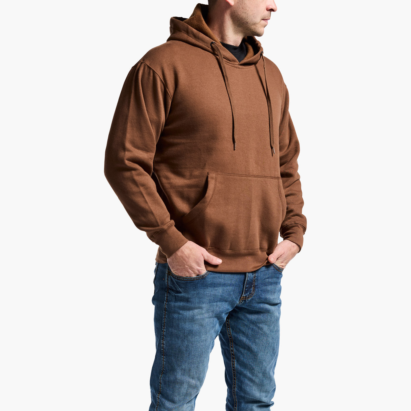 Person wearing a brown hoodie and blue jeans on a white background