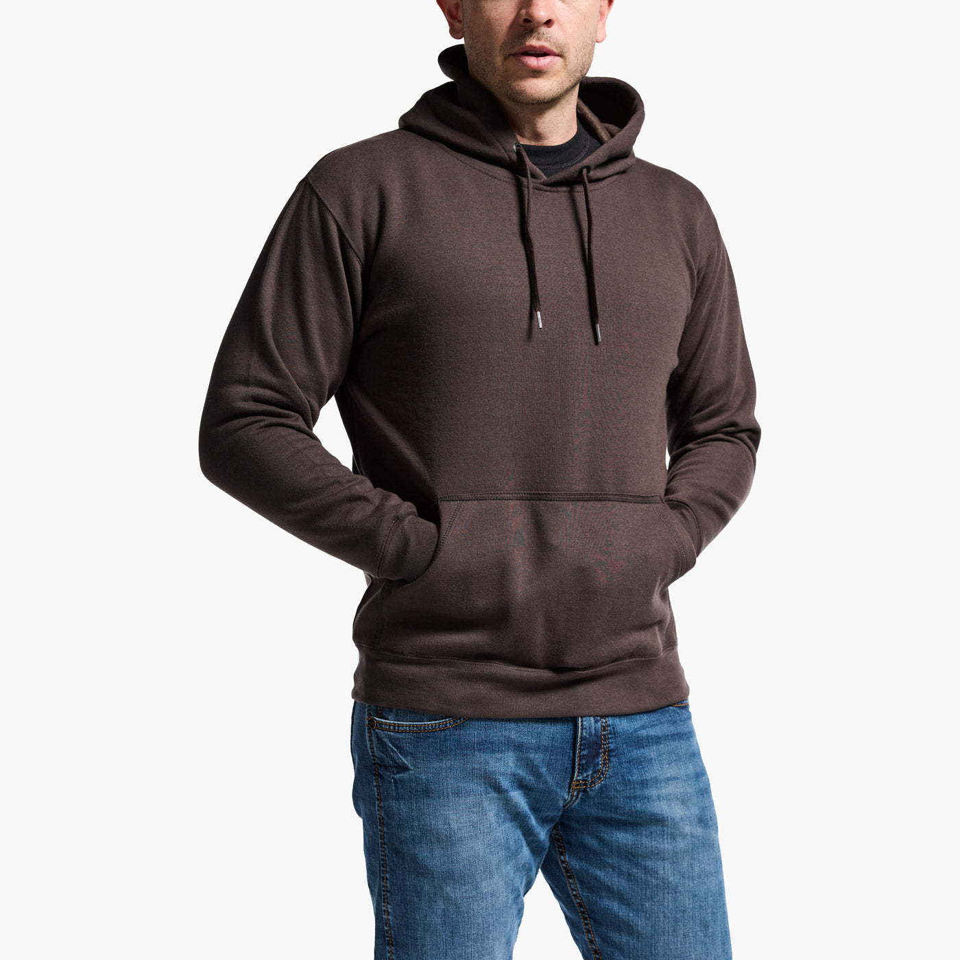 Man wearing a brown hoodie and blue jeans on a white background