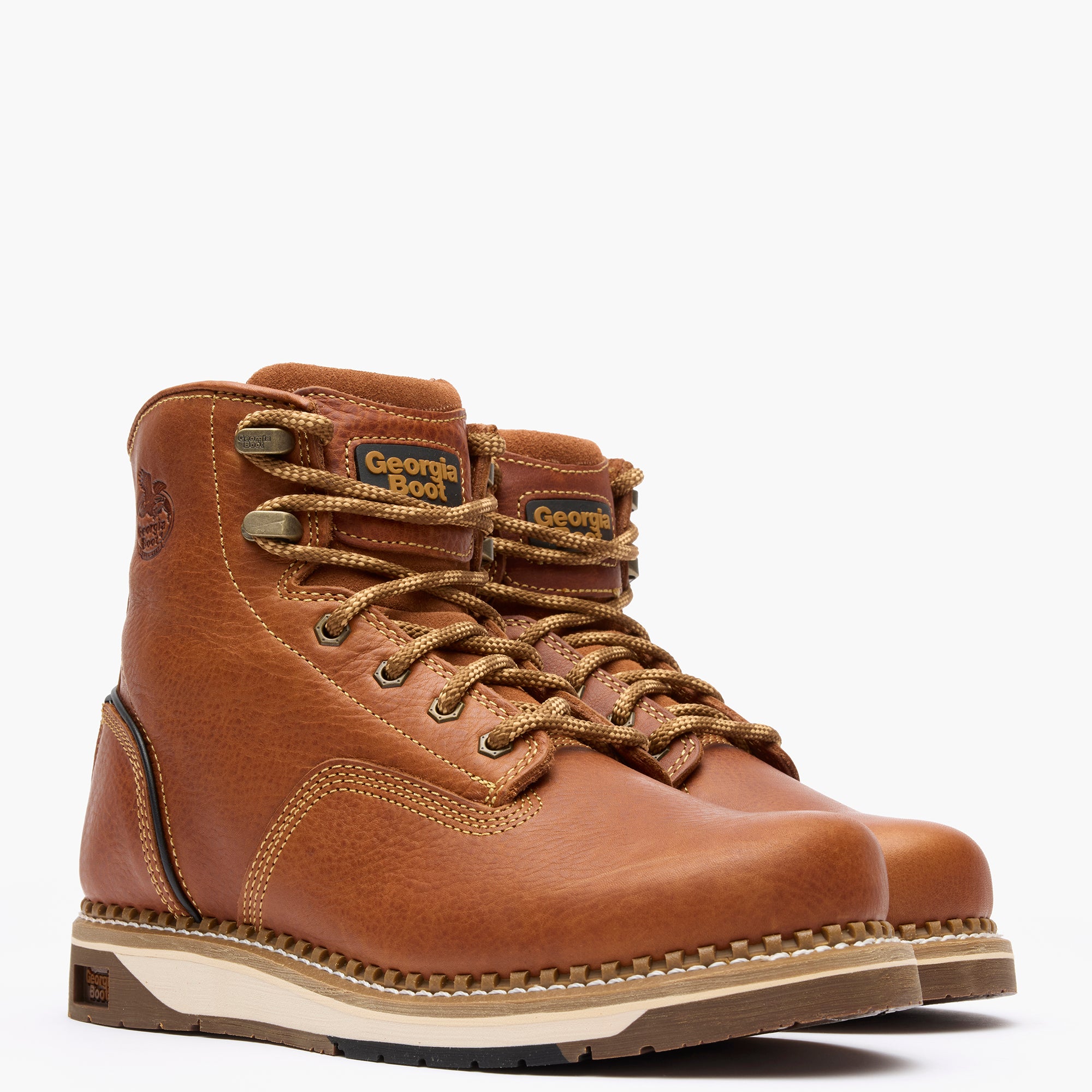 Brown leather boots with laces on a white background