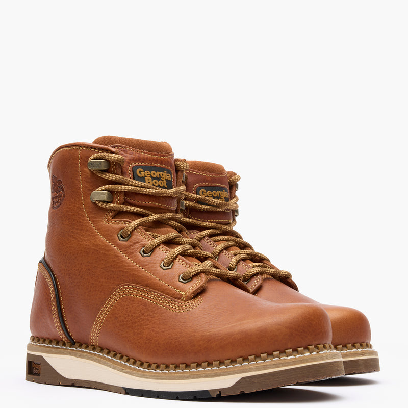 Brown leather boots with laces on a white background
