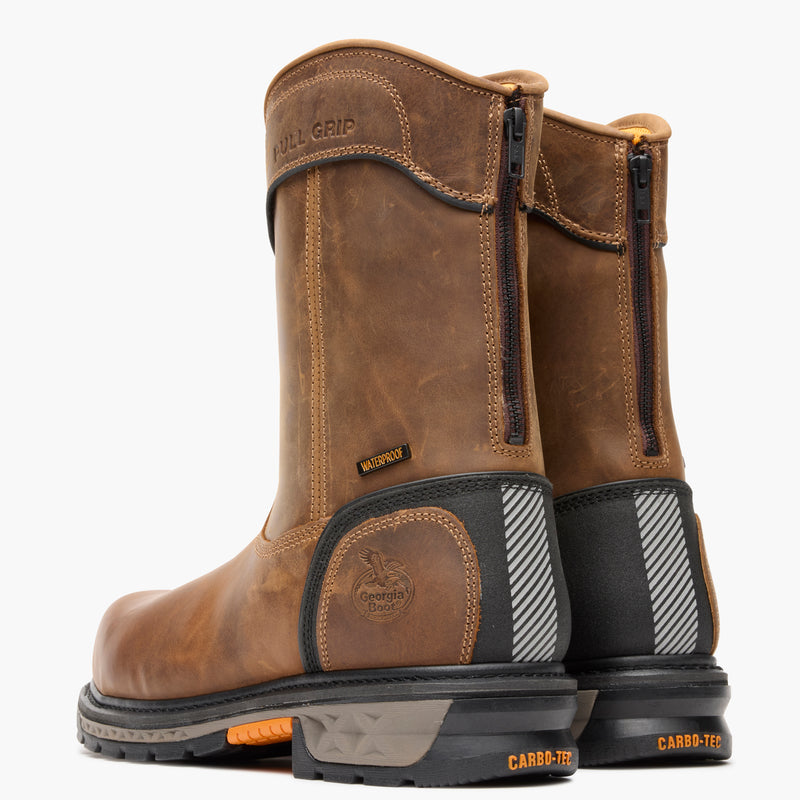 Pair of brown work boots with visible branding on a white background