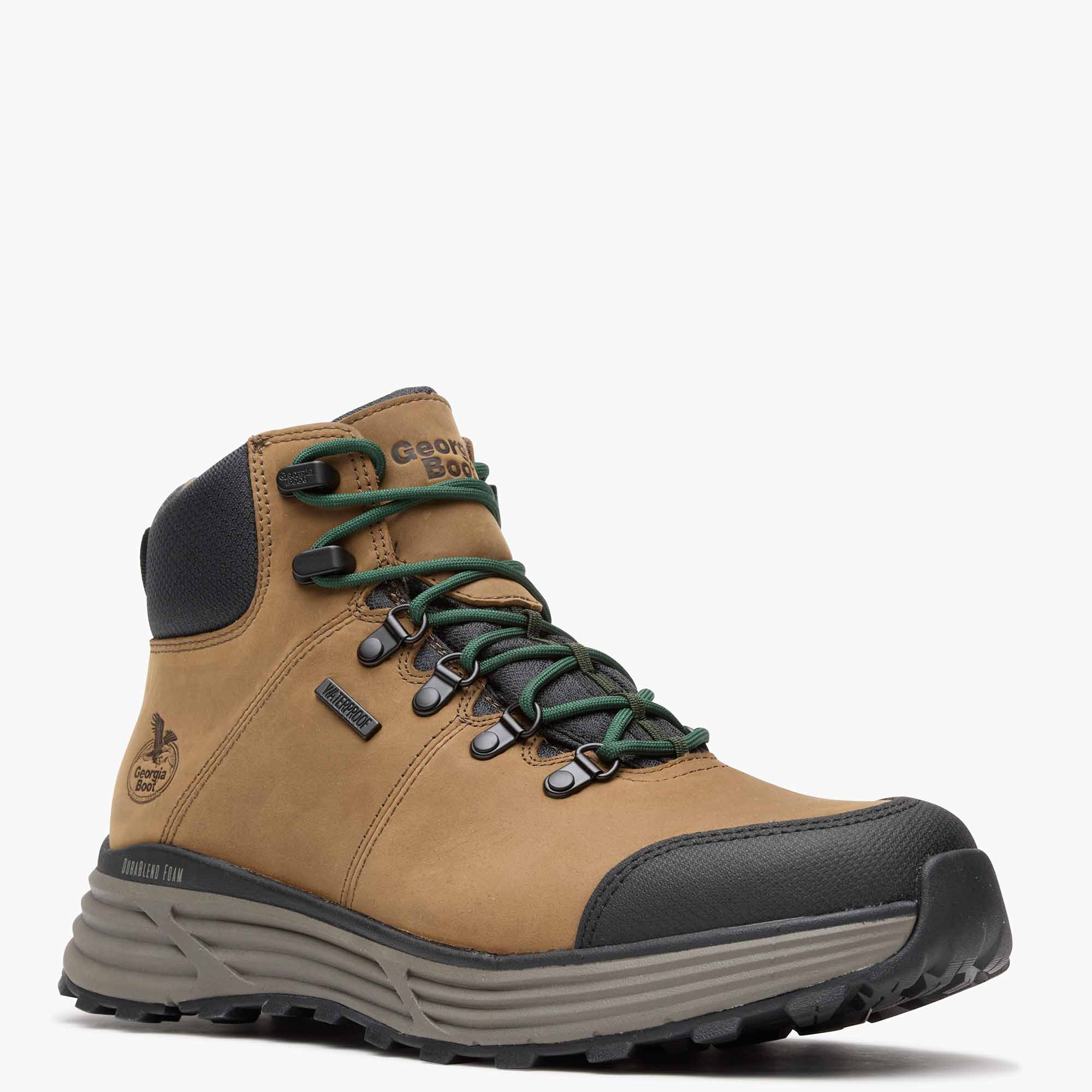 Tan hiking boot with green laces on a white background