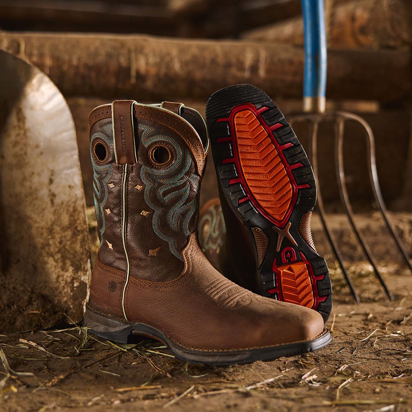 Durango Brown women's cowboy boots with detailed stitching on a rustic background