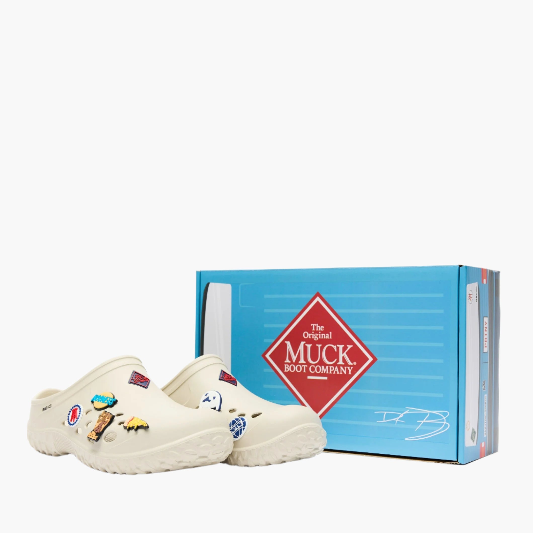 MLCMBS11 - Men's white clogs with colorful Barstool Sports tokens next to a blue Muck Boot Company box on a white background